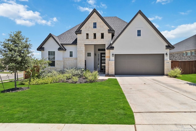 view of front facade featuring a front yard and a garage