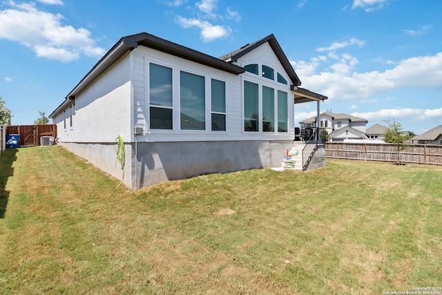 view of property exterior with a yard