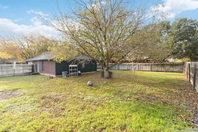 view of yard with a fenced backyard