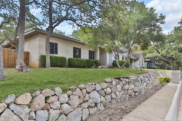 ranch-style house with a front yard