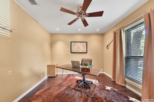 home office featuring ceiling fan and dark wood-type flooring