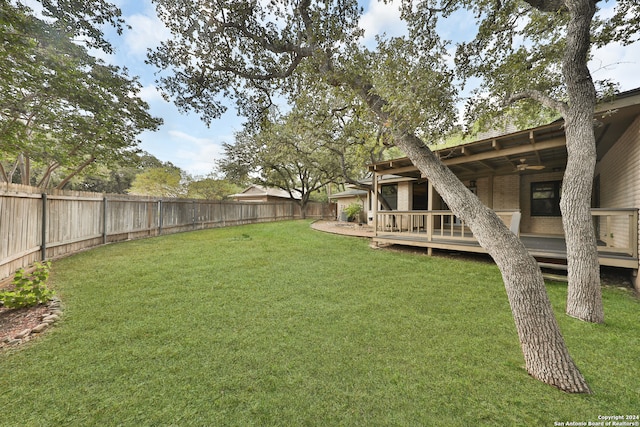 view of yard with a wooden deck