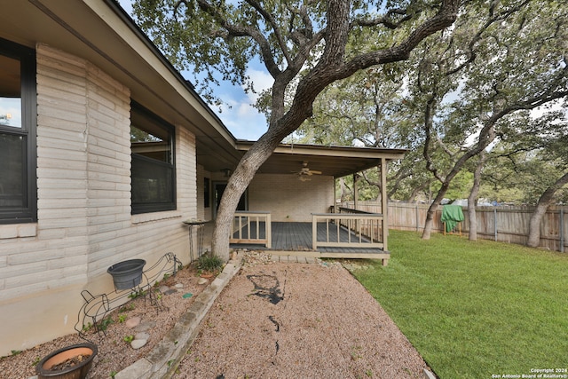 view of yard with ceiling fan