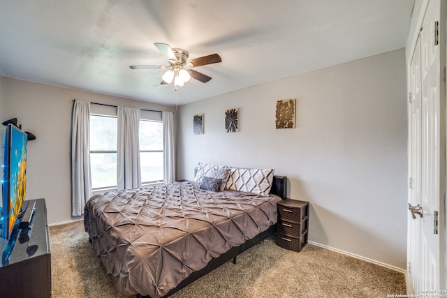 carpeted bedroom featuring ceiling fan