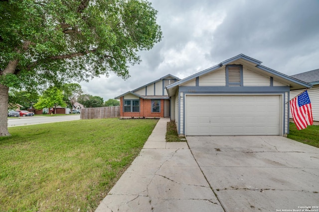 single story home with concrete driveway, a garage, fence, and a front lawn