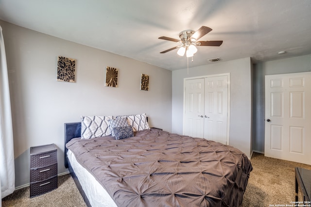 carpeted bedroom with a closet and ceiling fan