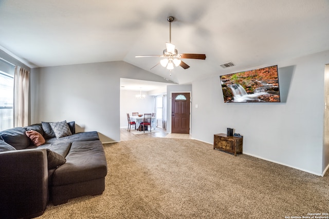 living room with ceiling fan, light carpet, and lofted ceiling