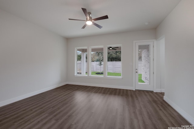 spare room with dark hardwood / wood-style flooring