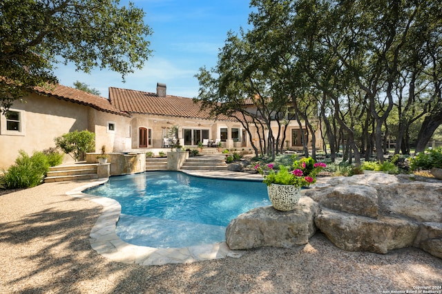 view of swimming pool with a patio