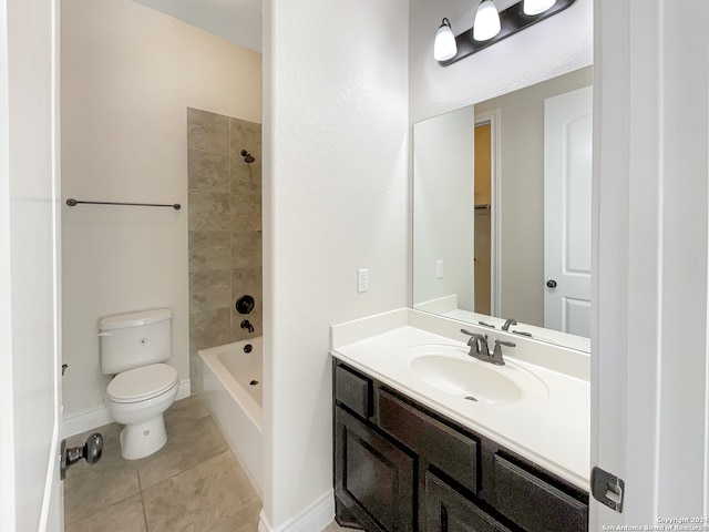 full bathroom featuring vanity, toilet, tiled shower / bath combo, and tile patterned floors