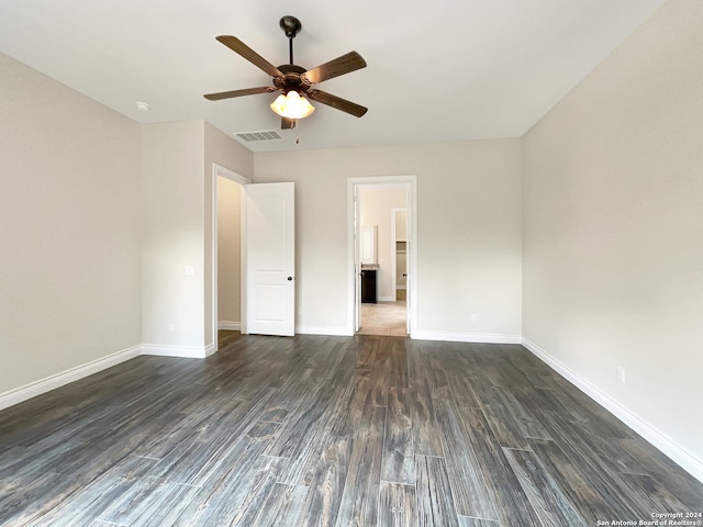 interior space with ceiling fan and dark hardwood / wood-style flooring