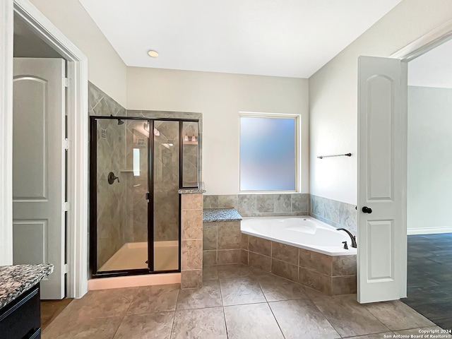 bathroom with vanity, plus walk in shower, and tile patterned flooring