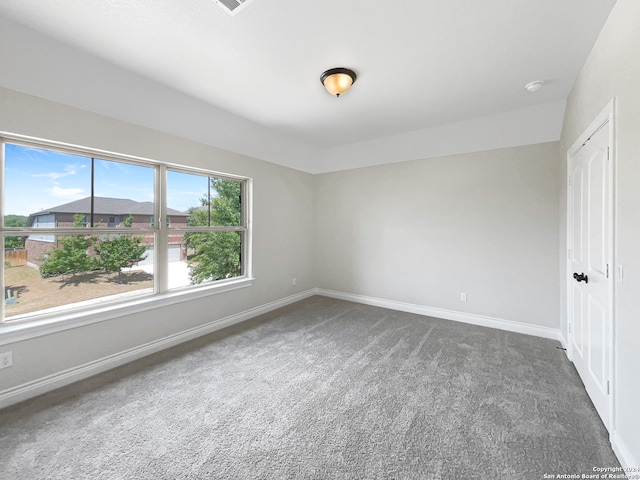 empty room with carpet flooring