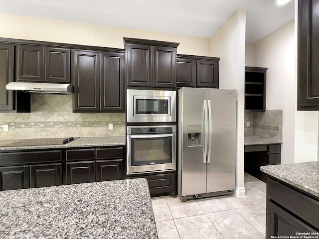 kitchen featuring light stone countertops, light tile patterned floors, tasteful backsplash, stainless steel appliances, and dark brown cabinetry