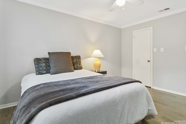 bedroom with dark carpet, crown molding, and ceiling fan