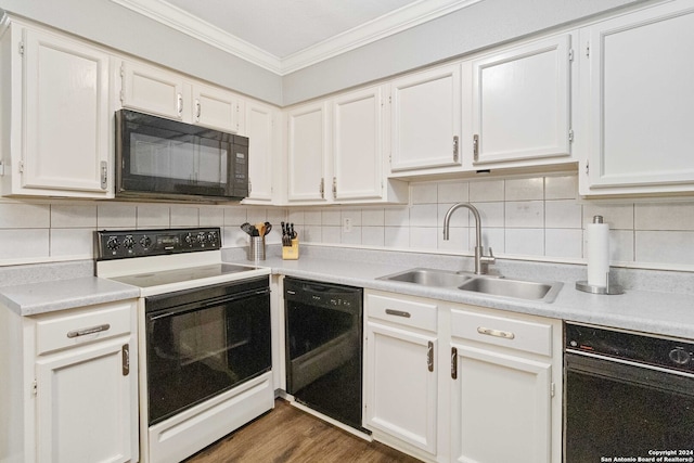 kitchen with black appliances, sink, white cabinetry, decorative backsplash, and dark hardwood / wood-style floors