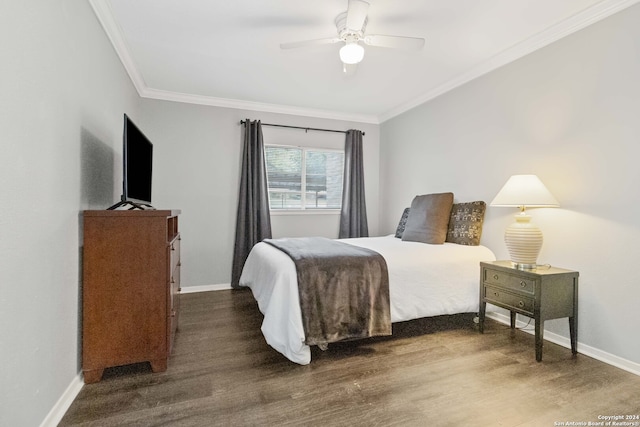 bedroom featuring dark hardwood / wood-style flooring, ornamental molding, and ceiling fan