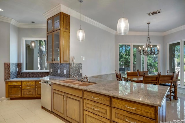 kitchen with an inviting chandelier, light stone countertops, dishwasher, sink, and decorative backsplash