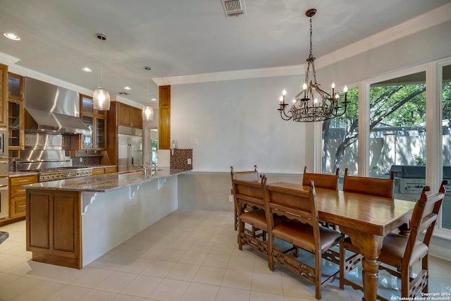 interior space featuring sink, a notable chandelier, and ornamental molding