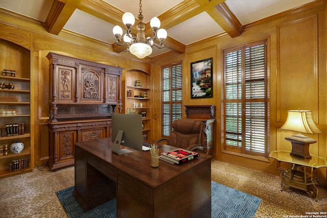 home office featuring coffered ceiling, beamed ceiling, built in shelves, ornamental molding, and a chandelier