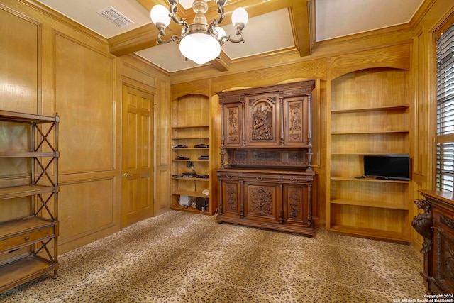 living room with ornamental molding, coffered ceiling, an inviting chandelier, and beam ceiling