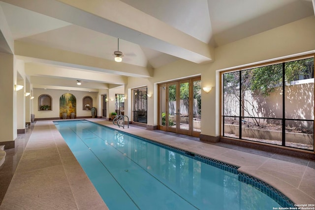 view of swimming pool featuring ceiling fan and french doors