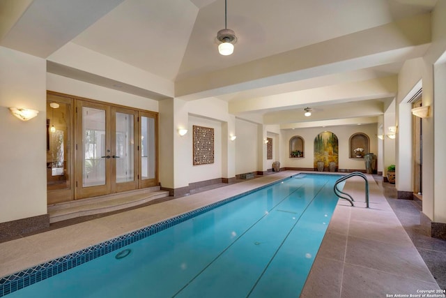 view of swimming pool featuring french doors