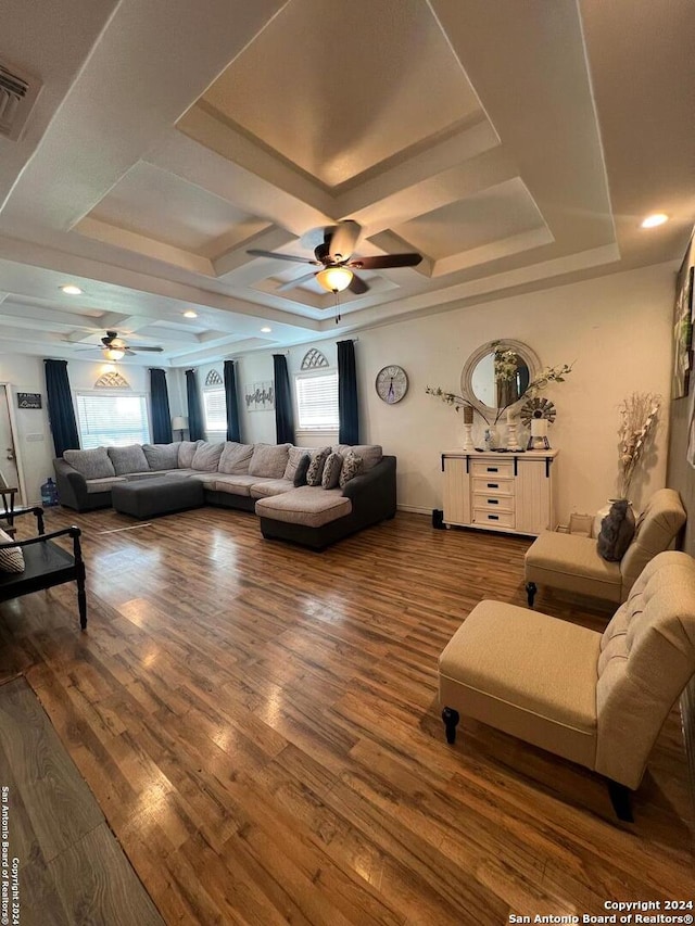 living room with plenty of natural light, coffered ceiling, ceiling fan, and hardwood / wood-style flooring