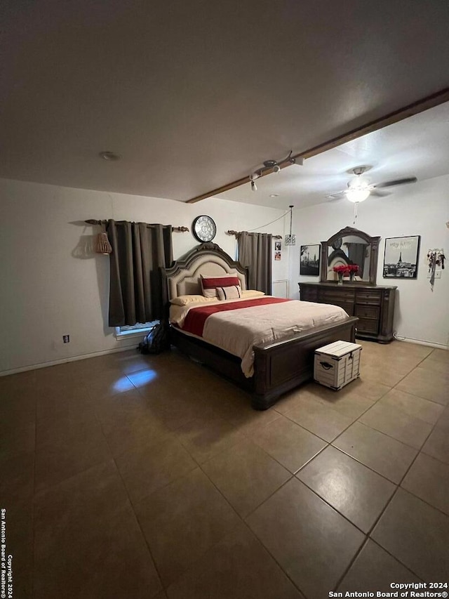 bedroom with track lighting, ceiling fan, and tile patterned floors