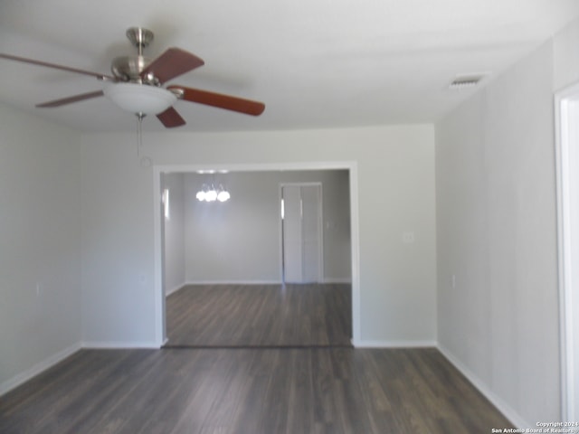 spare room with ceiling fan and dark hardwood / wood-style flooring