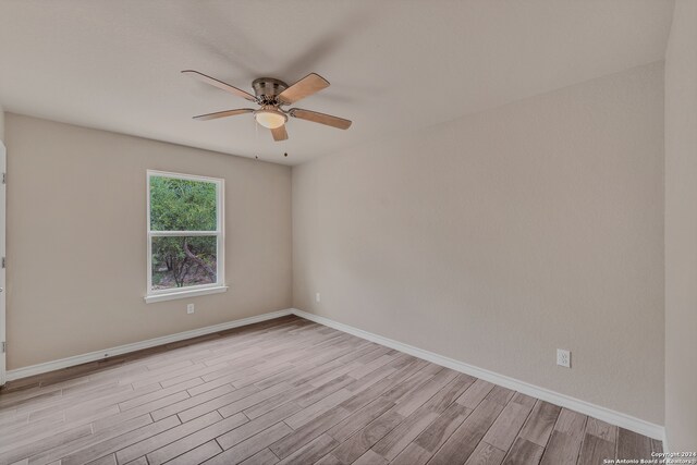 unfurnished room with ceiling fan and light hardwood / wood-style flooring