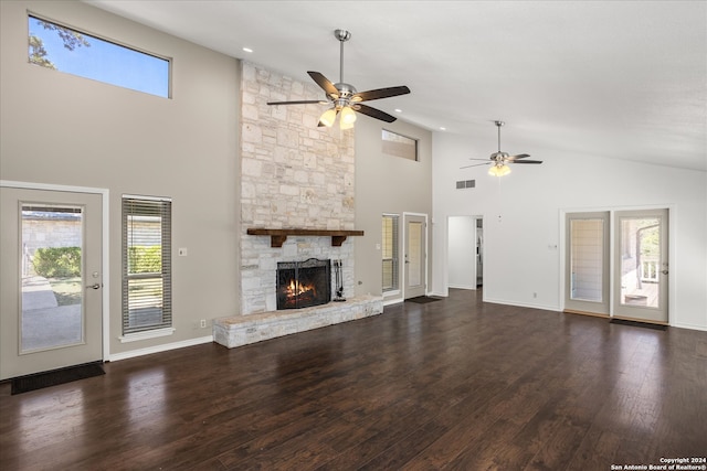 unfurnished living room with a fireplace, dark hardwood / wood-style flooring, high vaulted ceiling, and ceiling fan