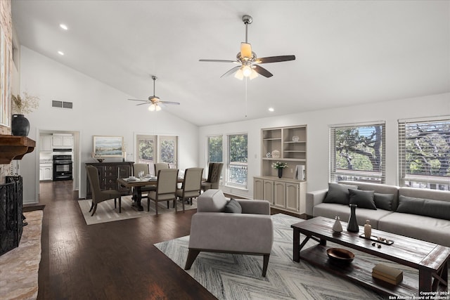 living room with built in shelves, ceiling fan, high vaulted ceiling, and dark hardwood / wood-style flooring