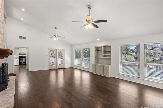 unfurnished living room with dark hardwood / wood-style flooring, high vaulted ceiling, built in shelves, and ceiling fan