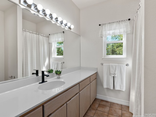 bathroom with vanity and tile patterned flooring