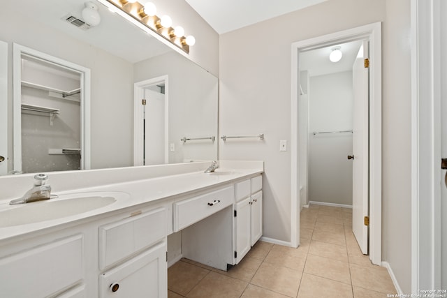 bathroom with tile patterned flooring and vanity