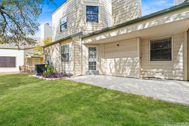 exterior space with a yard and central air condition unit