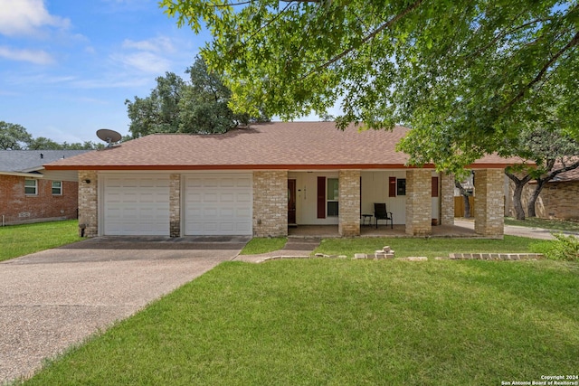 ranch-style house featuring a garage and a front yard