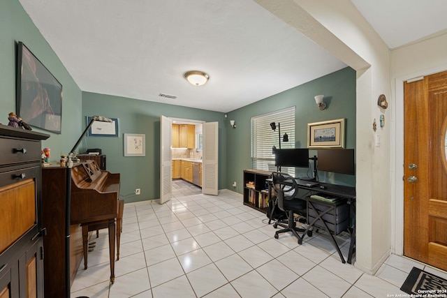 home office featuring light tile patterned flooring