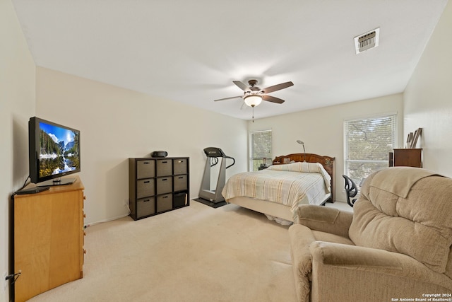 carpeted bedroom with ceiling fan