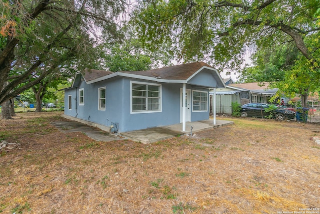 back of house with a patio area