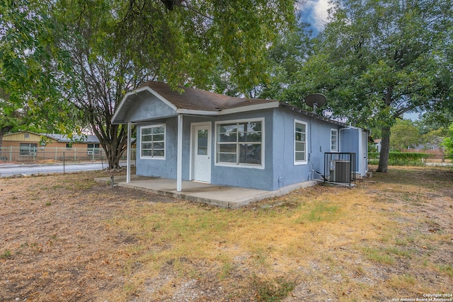 view of front of property with central AC unit