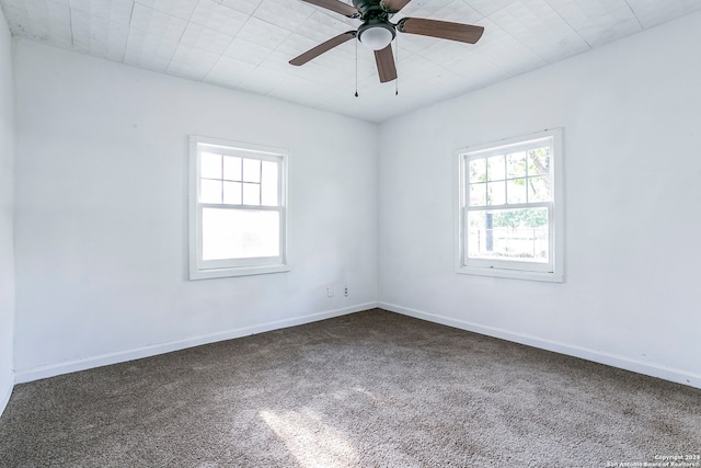 empty room with carpet and ceiling fan