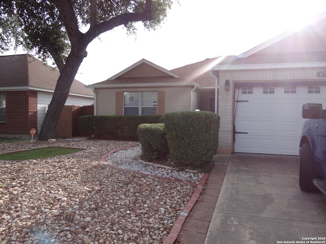 ranch-style home with a garage