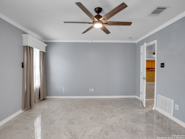 unfurnished room with ceiling fan and crown molding