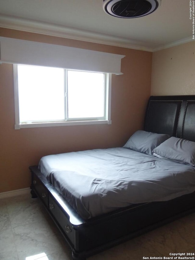 bedroom featuring crown molding