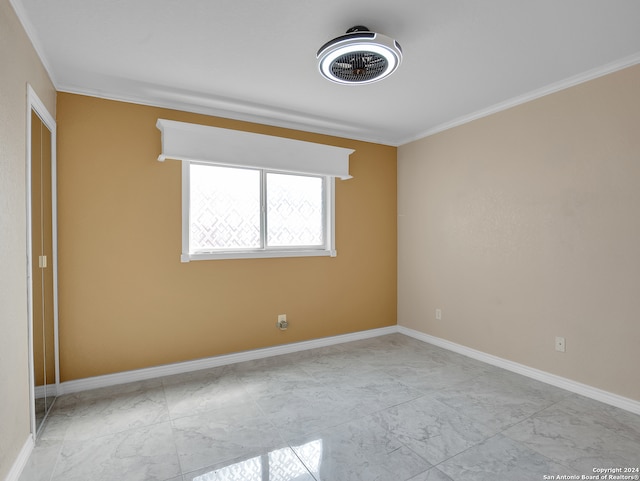 unfurnished room featuring ornamental molding