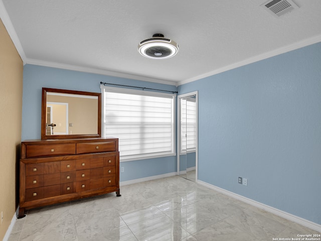 unfurnished bedroom featuring ornamental molding