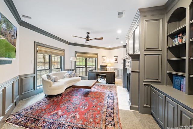 living room with ceiling fan and crown molding