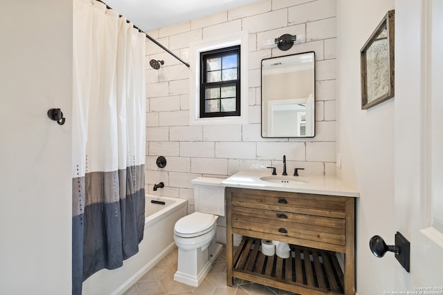 full bathroom featuring tile walls, tile patterned floors, shower / tub combo, vanity, and toilet